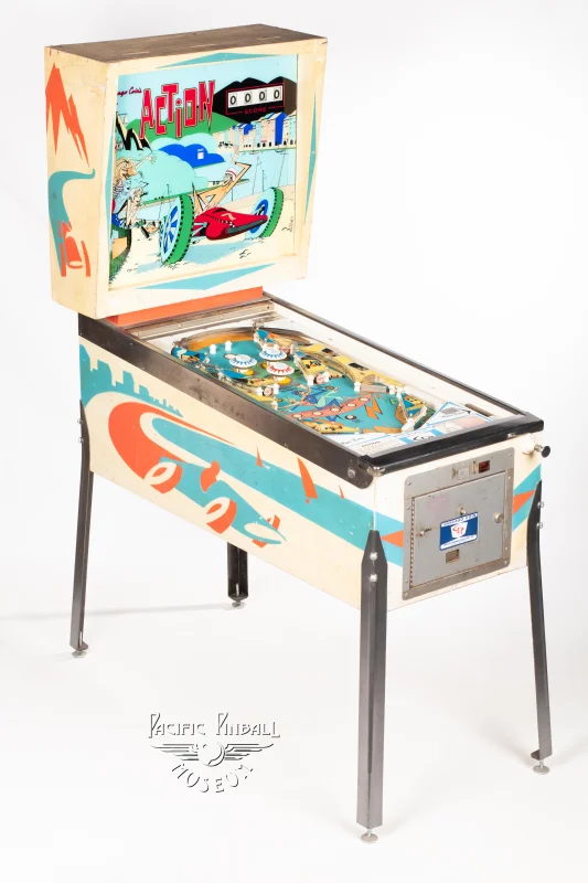 action-194-34.jpg pinball machine - Preview image showing playfield artwork and design details