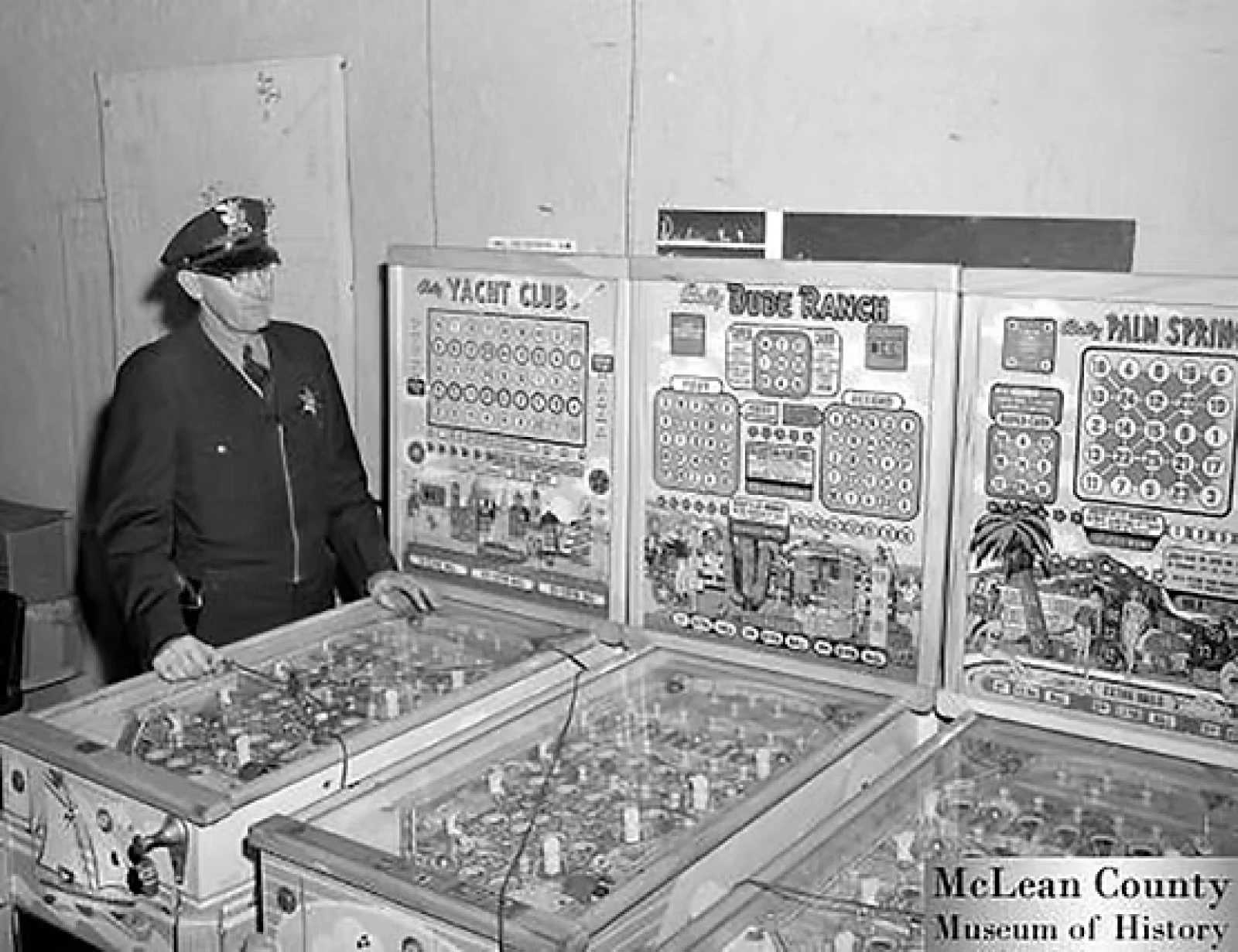 Police Officer Looking at Bingo Machines