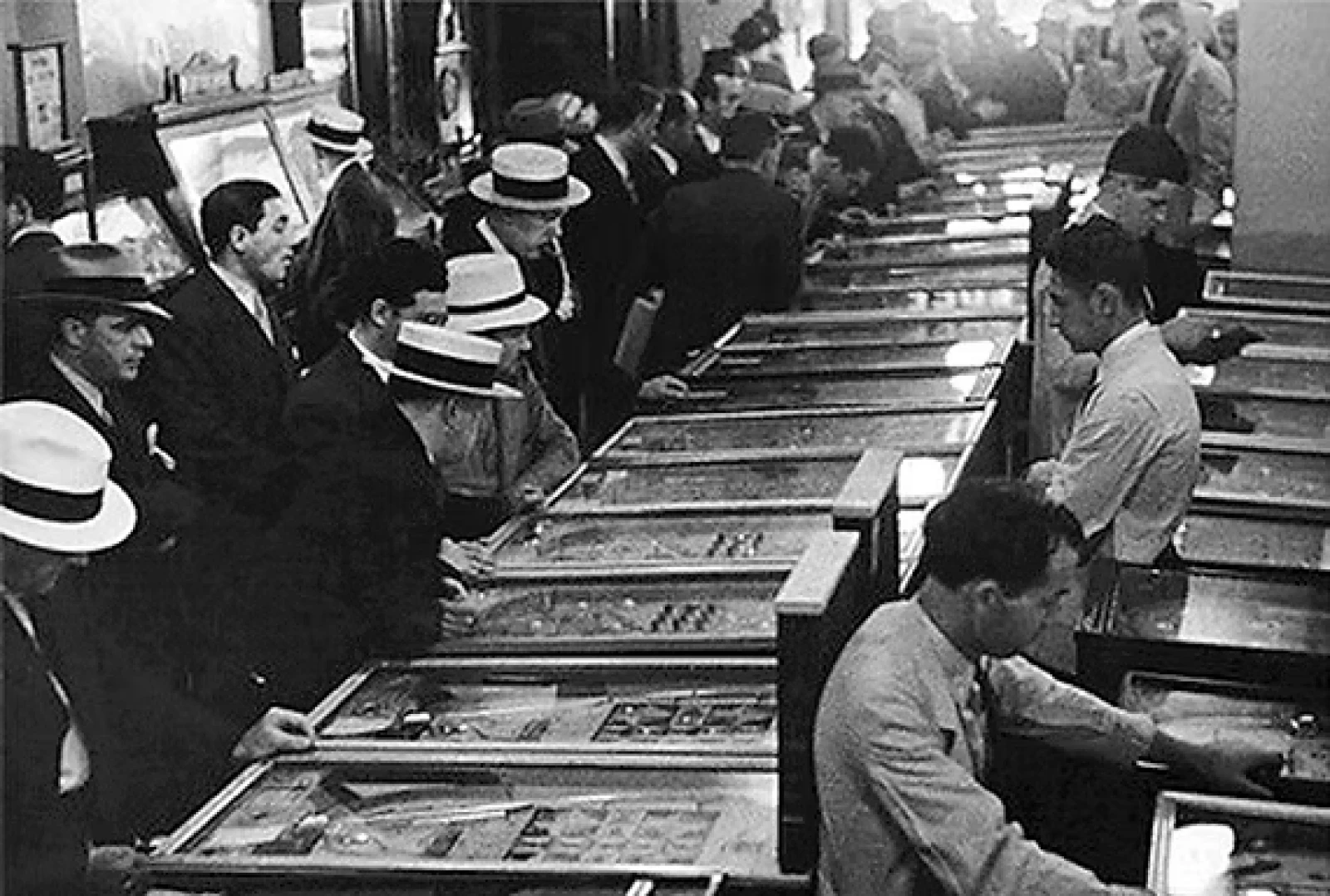 Men playing pinball